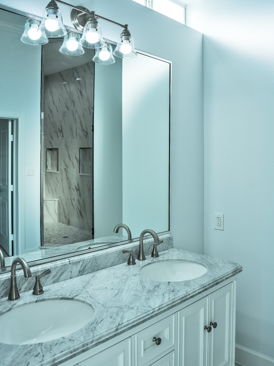 9435A Oberrender Road Needville, TX 77461 - Photo 28 of 36 a bathroom with a granite countertop sink a large mirror and a shower