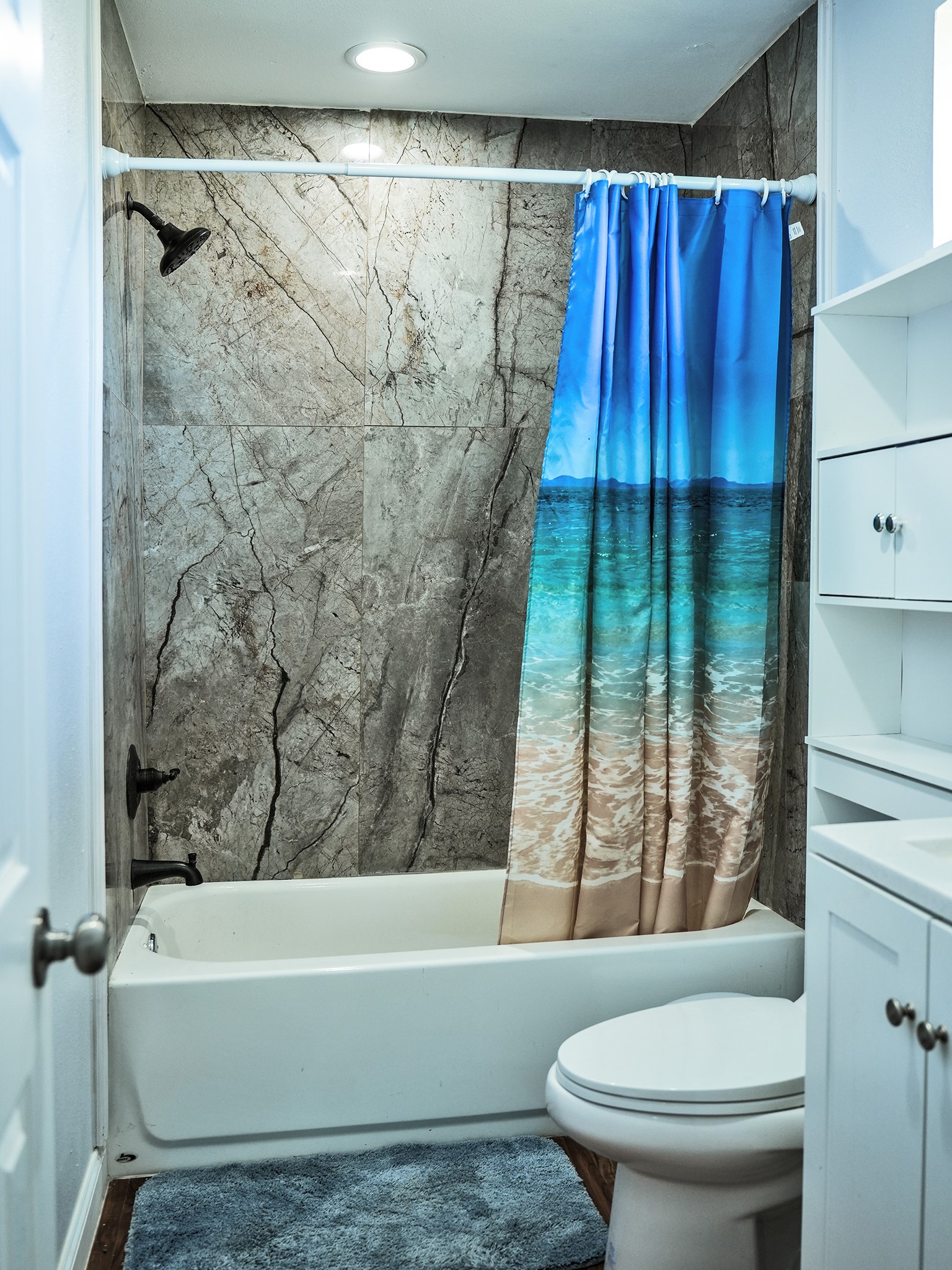 9435A Oberrender Road Needville, TX 77461 - Photo 34 of 36 a bathroom with a bathtub and shower