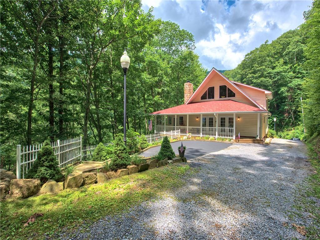 624 Bent Tree Road Maggie Valley, NC 28751 - Photo 1 of 48 a front view of a house with a yard