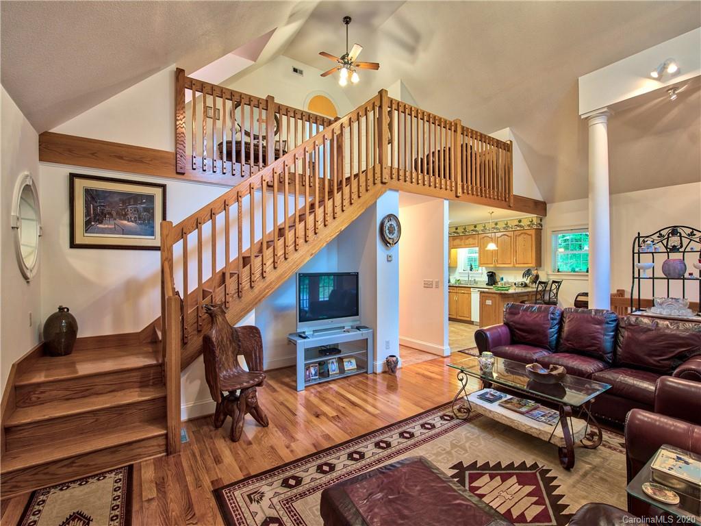 624 Bent Tree Road Maggie Valley, NC 28751 - Photo 6 of 48 a living room with furniture fireplace and a flat screen tv