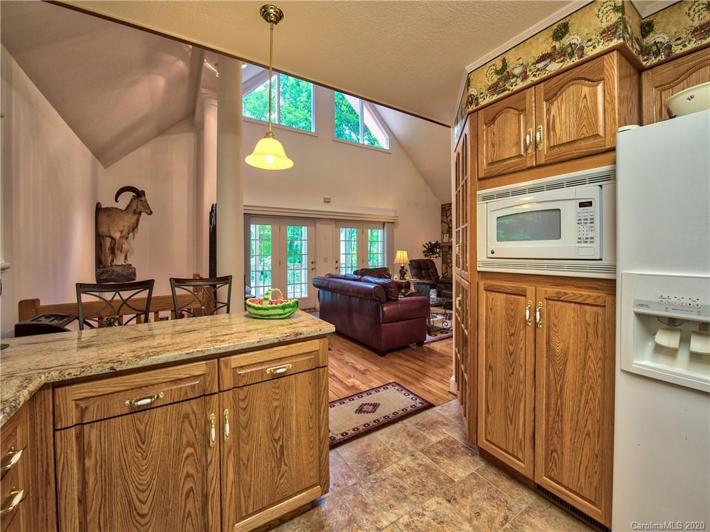 624 Bent Tree Road Maggie Valley, NC 28751 - Photo 9 of 48 a spacious bathroom with a sink a vanity and a mirror