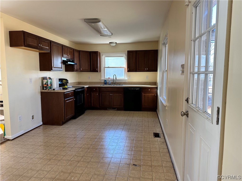 2332 Coxendale Road Chester, VA 23831 - Photo 4 of 11 a large kitchen with stainless steel appliances granite countertop a stove top oven a sink dishwasher and a refrigerator