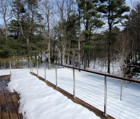 4 Old Farm Road Lincoln, MA 01773 - Photo 11 of 21 a view of a patio with wooden fence and lake
