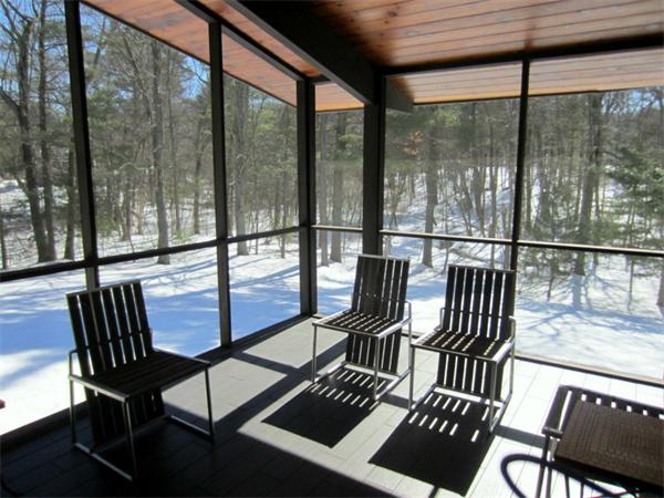 4 Old Farm Road Lincoln, MA 01773 - Photo 7 of 21 a view of a city from a balcony with furniture