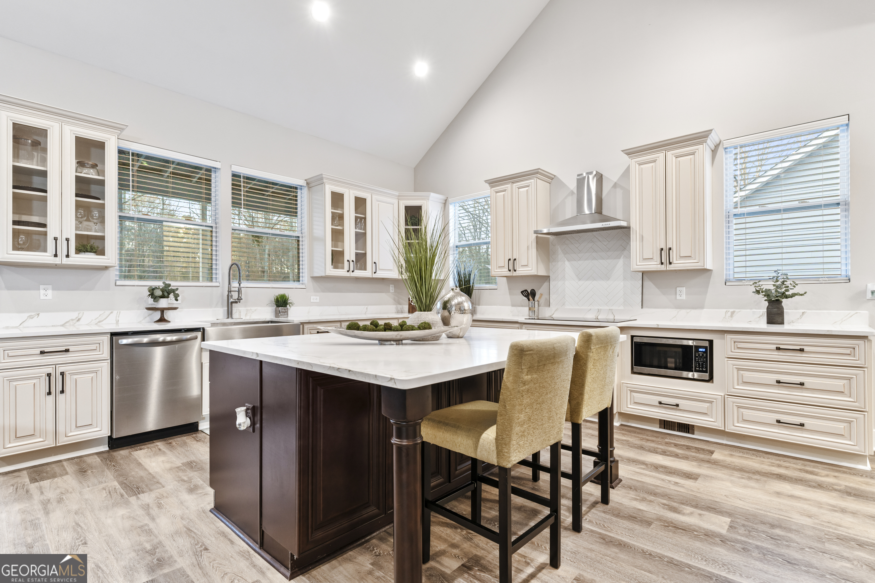 5410 Beth Drive Austell, GA 30106 - Photo 12 of 36 a kitchen with stainless steel appliances kitchen island granite countertop a sink and cabinets