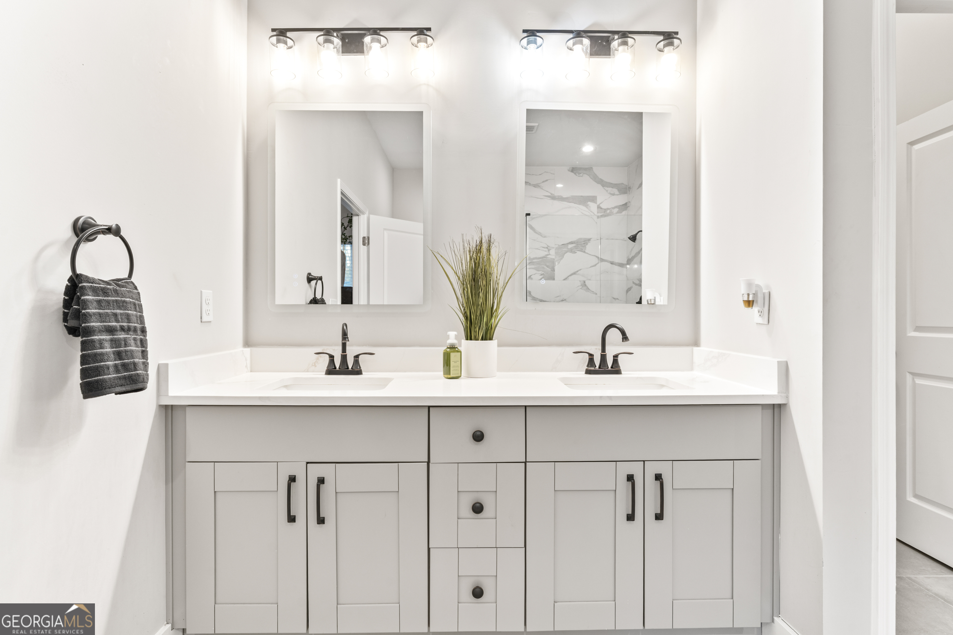5410 Beth Drive Austell, GA 30106 - Photo 23 of 36 a bathroom with double sink and a mirror