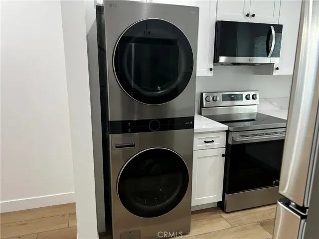 a kitchen with a stove and a microwave