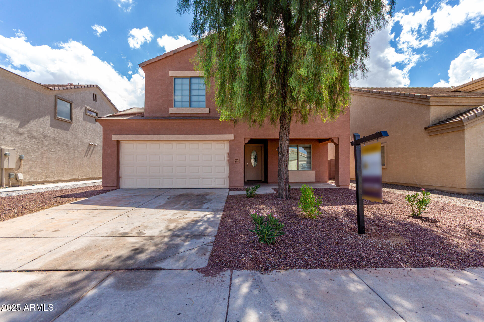 8315 West Crown King Road Tolleson, AZ 85353 - Photo 1 of 31 a front view of a house with garden