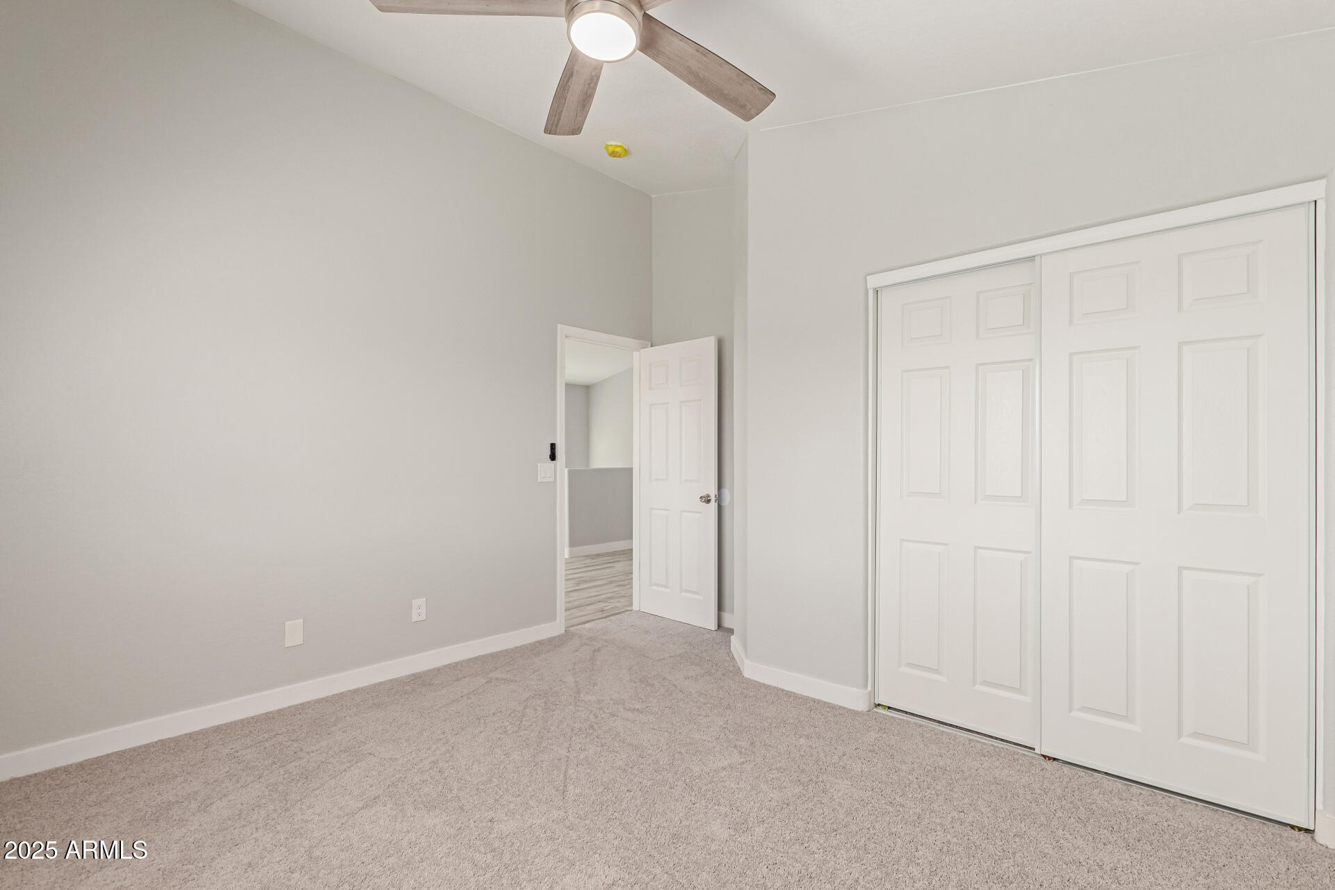 8315 West Crown King Road Tolleson, AZ 85353 - Photo 17 of 31 an empty room with windows