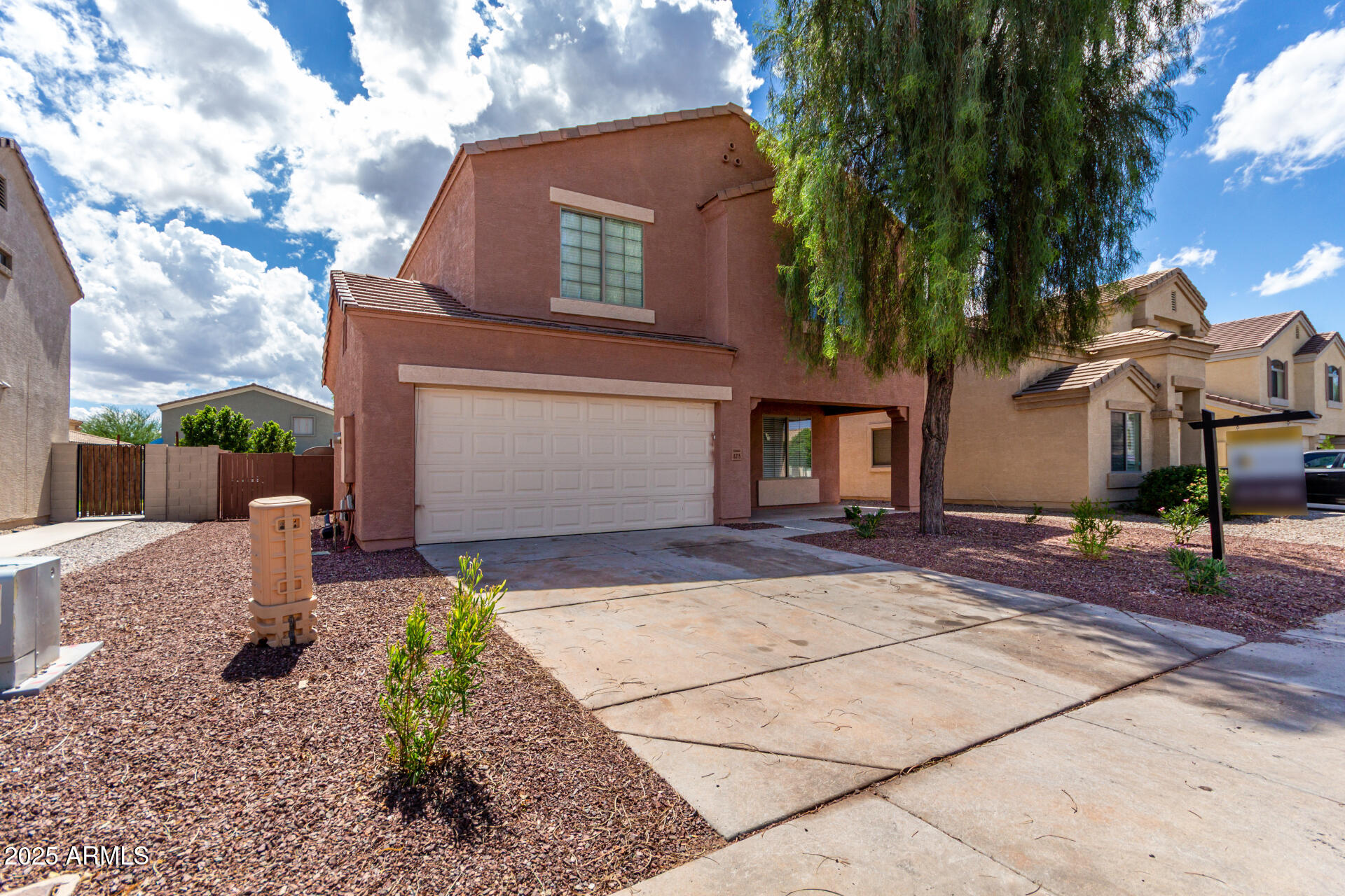 8315 West Crown King Road Tolleson, AZ 85353 - Photo 2 of 31 a front view of a house with garden