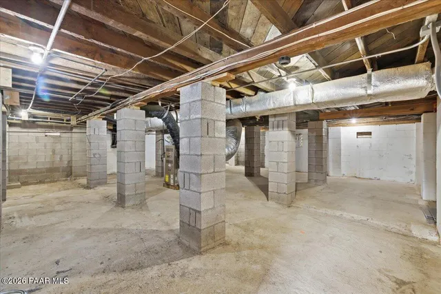 a view of an empty room with wooden roof
