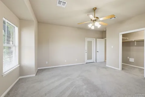 a view of a balcony with wooden floor