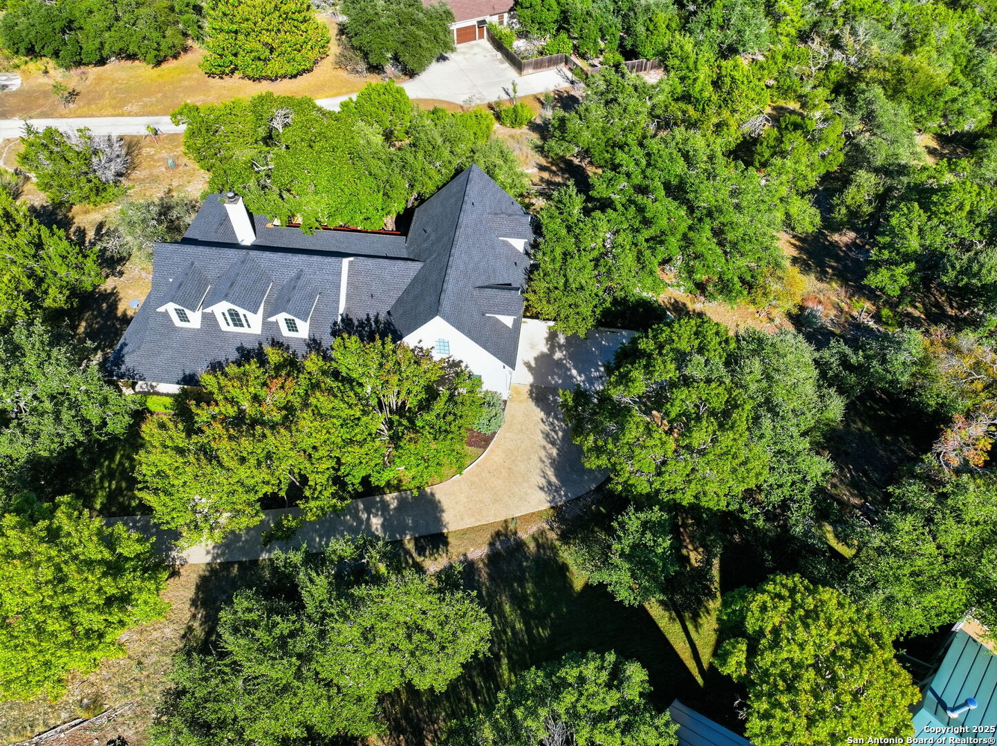 2291 Frontier Spring Branch, TX 78070 - Photo 56 of 58 an aerial view of a house with a yard and outdoor seating