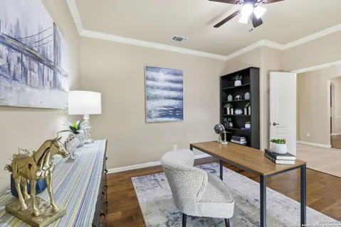 a kitchen with kitchen island granite countertop a stove top oven a sink a counter top space and cabinets