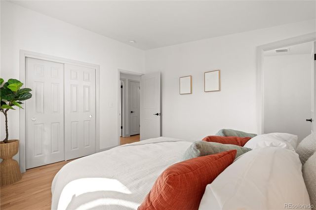 a aerial view of a house with a yard and large trees