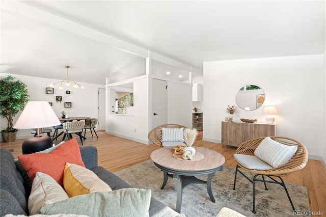 a kitchen with a sink appliances and cabinets