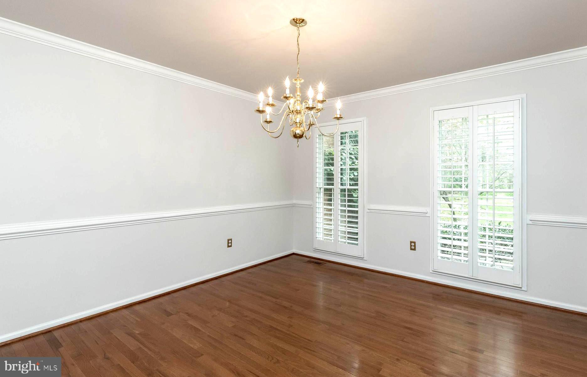 3103 Arrowhead Farms Road Gambrills, MD 21054 - Photo 13 of 55 Chandeliered Formal Dining Room with Chair Rail