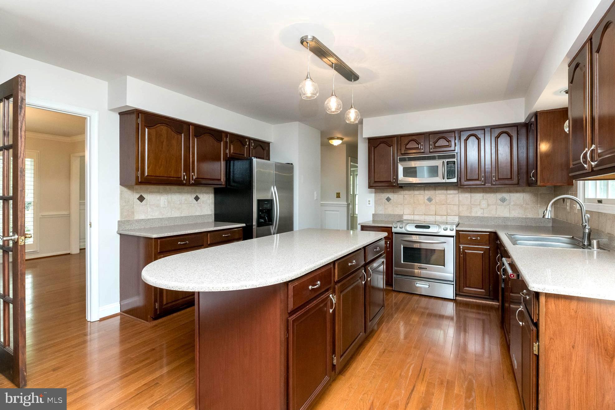 3103 Arrowhead Farms Road Gambrills, MD 21054 - Photo 16 of 55 Sleek Granite Counters . Custom Wood Cabinetry