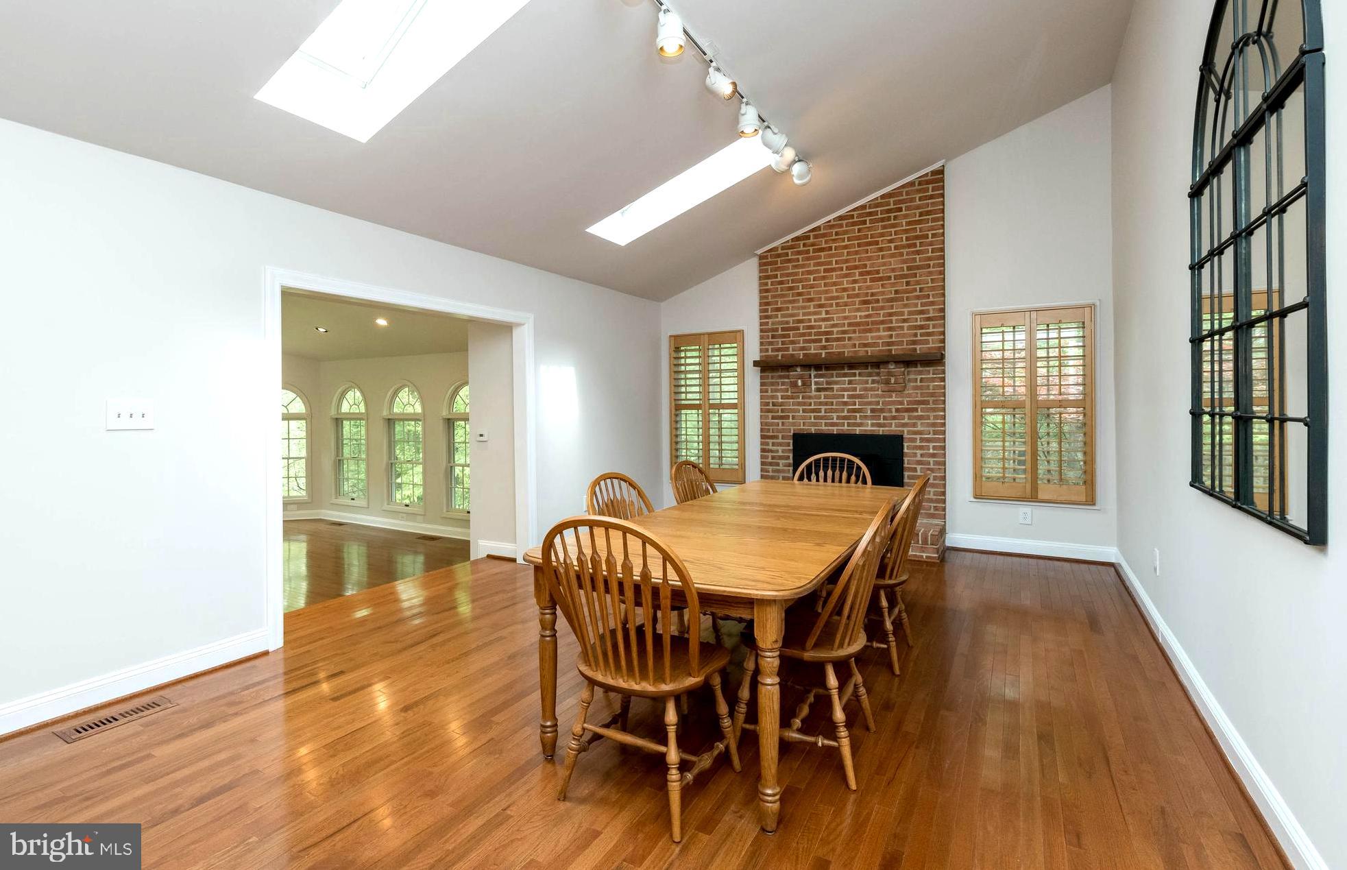 3103 Arrowhead Farms Road Gambrills, MD 21054 - Photo 19 of 55 Vaulted Room Sharing Brick Fireplace Ambiance