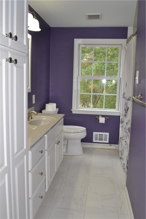 5913 Graybrook Drive Export, PA 15632 - Photo 13 of 24 a bathroom with a granite countertop toilet a sink and a bathtub