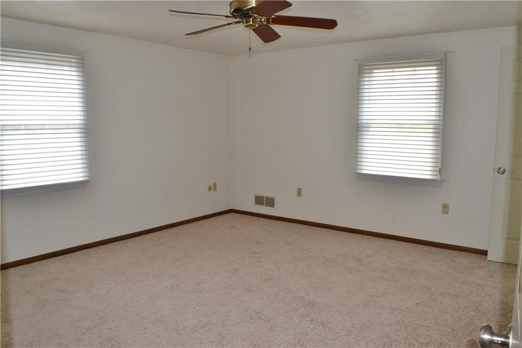 5913 Graybrook Drive Export, PA 15632 - Photo 16 of 24 an empty room with a window and a ceiling fan