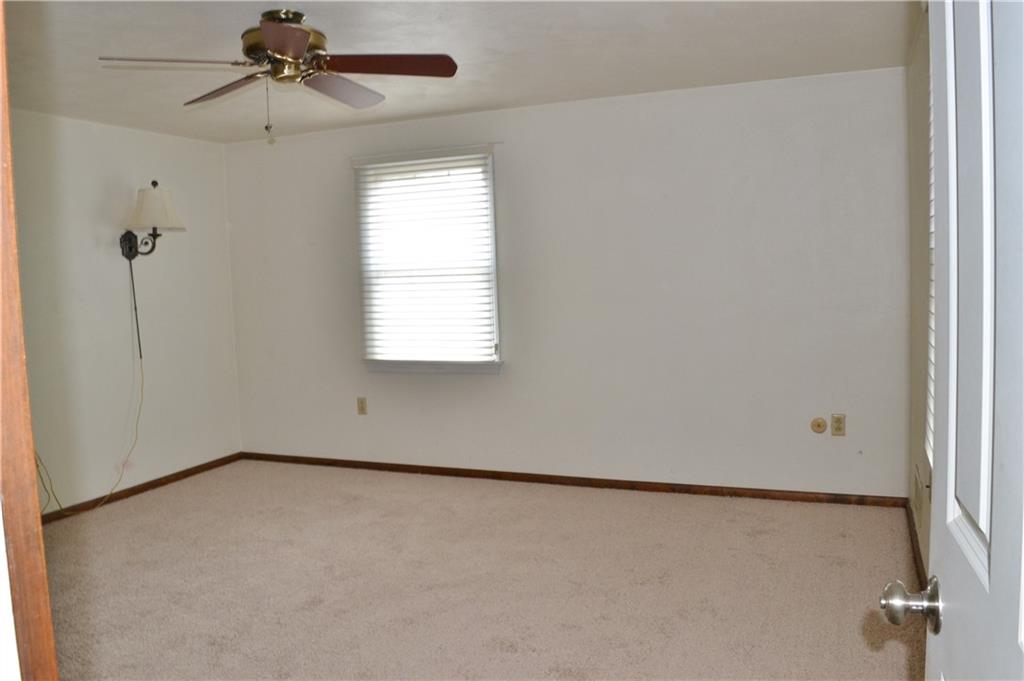 5913 Graybrook Drive Export, PA 15632 - Photo 17 of 24 an empty room with a window and a ceiling fan