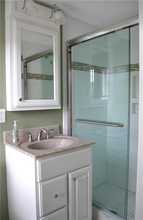 5913 Graybrook Drive Export, PA 15632 - Photo 18 of 24 a bathroom with a sink and mirror