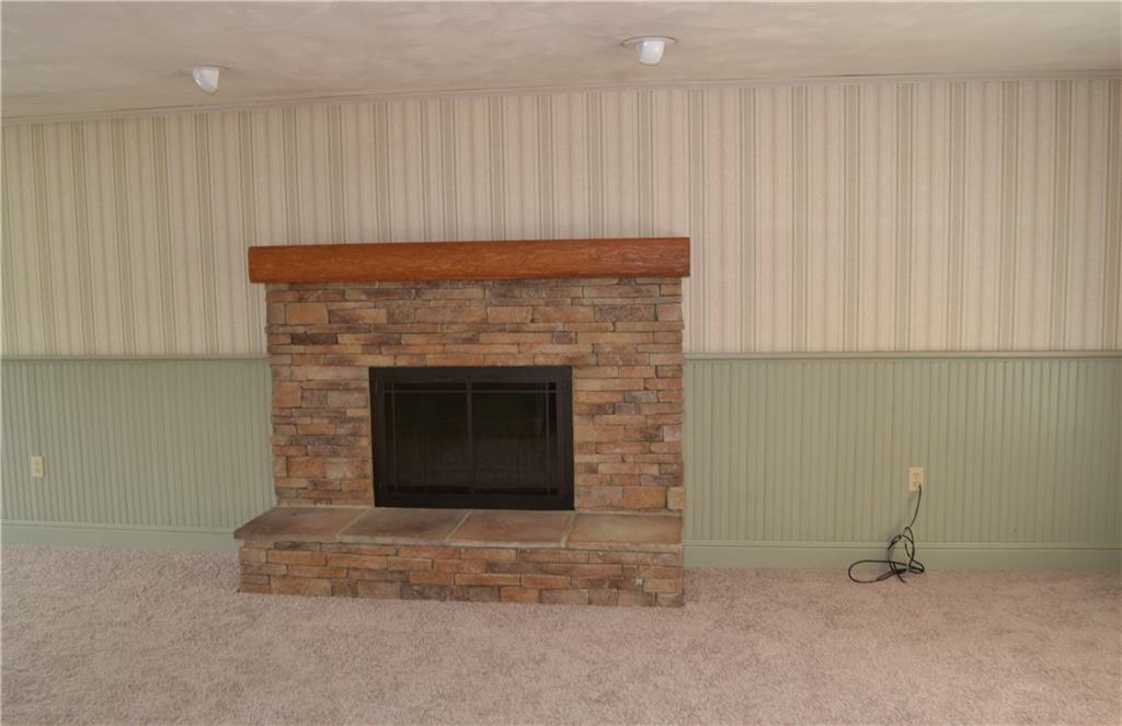5913 Graybrook Drive Export, PA 15632 - Photo 5 of 24 a living room with a fireplace and a fireplace