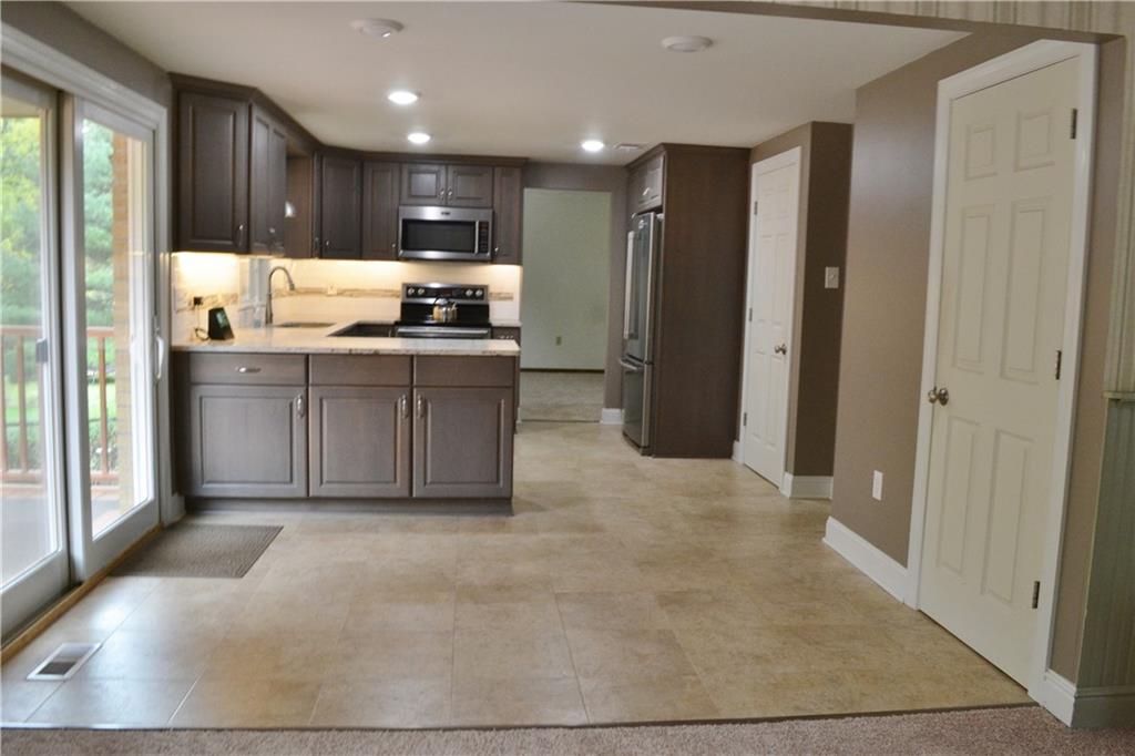5913 Graybrook Drive Export, PA 15632 - Photo 7 of 24 a kitchen with stainless steel appliances granite countertop a refrigerator and a stove top oven