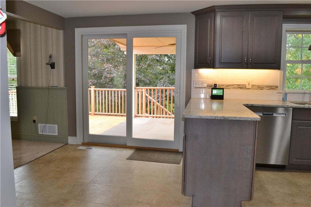 5913 Graybrook Drive Export, PA 15632 - Photo 9 of 24 a kitchen with granite countertop a refrigerator and a sink