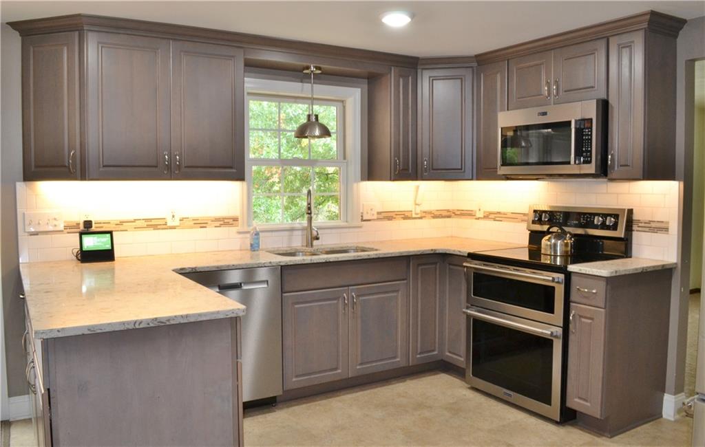 5913 Graybrook Drive Export, PA 15632 - Photo 10 of 24 a kitchen with stainless steel appliances a sink a stove and microwave