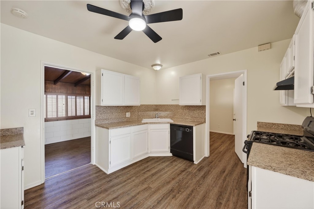 8971 Glencoe Drive Riverside, CA 92503 - Photo 13 of 41 a kitchen with a stove and a refrigerator