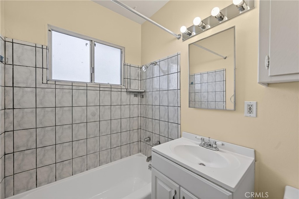 8971 Glencoe Drive Riverside, CA 92503 - Photo 26 of 41 a bathroom with a sink a toilet and shower