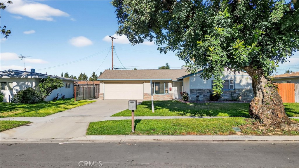8971 Glencoe Drive Riverside, CA 92503 - Photo 3 of 41 a view of a house with a big yard plants and large trees