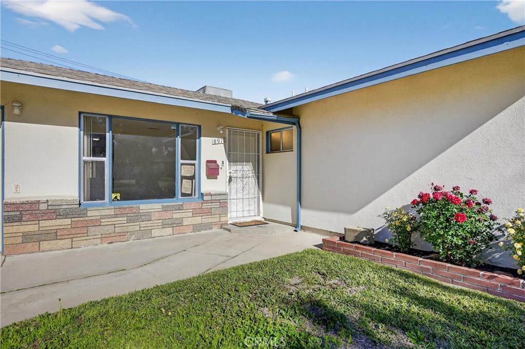 8971 Glencoe Drive Riverside, CA 92503 - Photo 6 of 41 a view of a house with a backyard and a garden