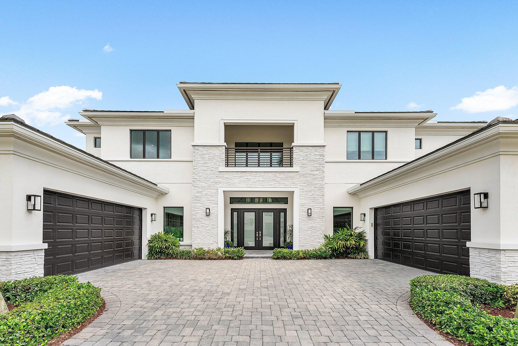2707 Northwest 75th Street Boca Raton, FL 33496 - Photo 2 of 74 front view of a house with a yard