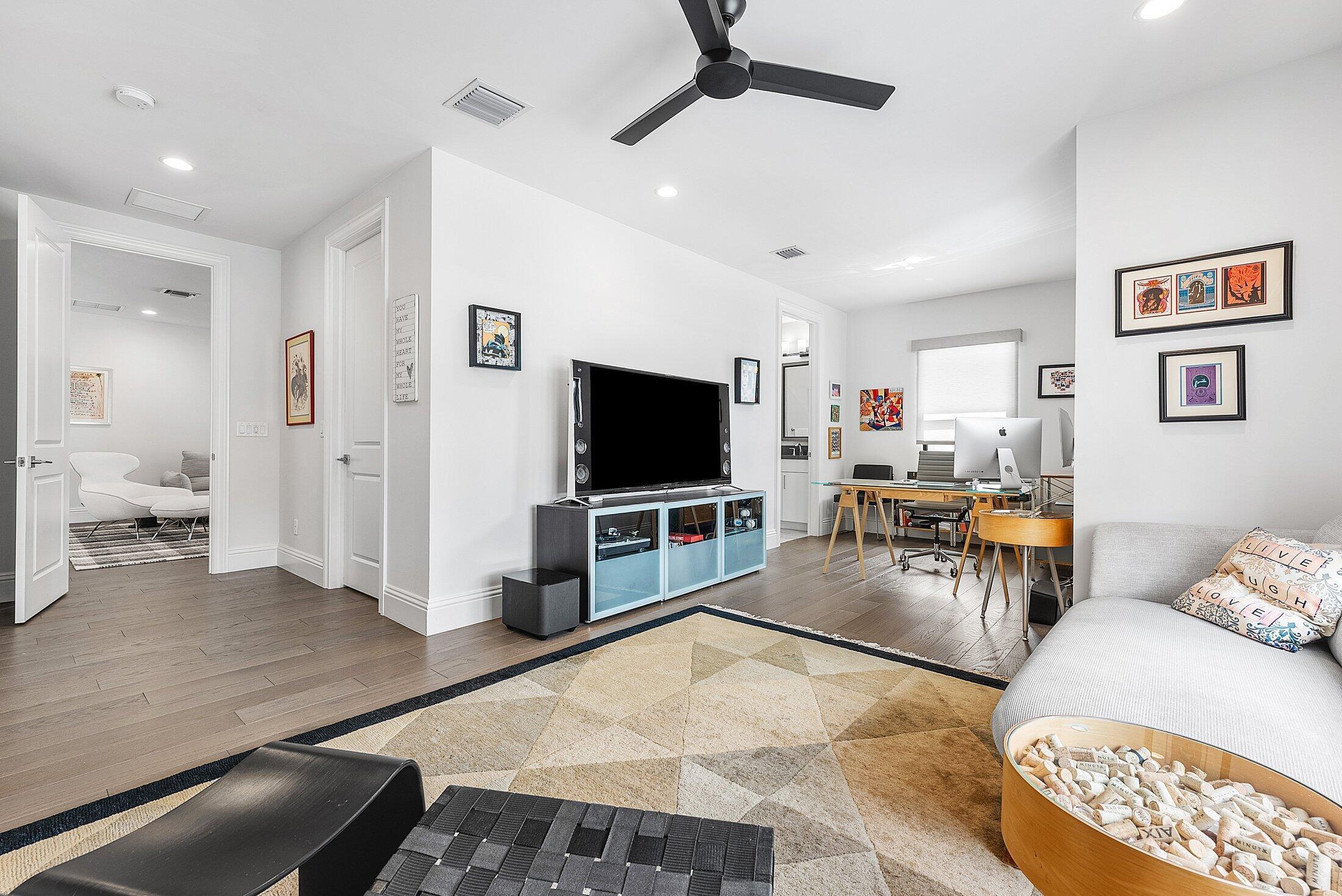 2707 Northwest 75th Street Boca Raton, FL 33496 - Photo 23 of 74 a living room with furniture and a flat screen tv