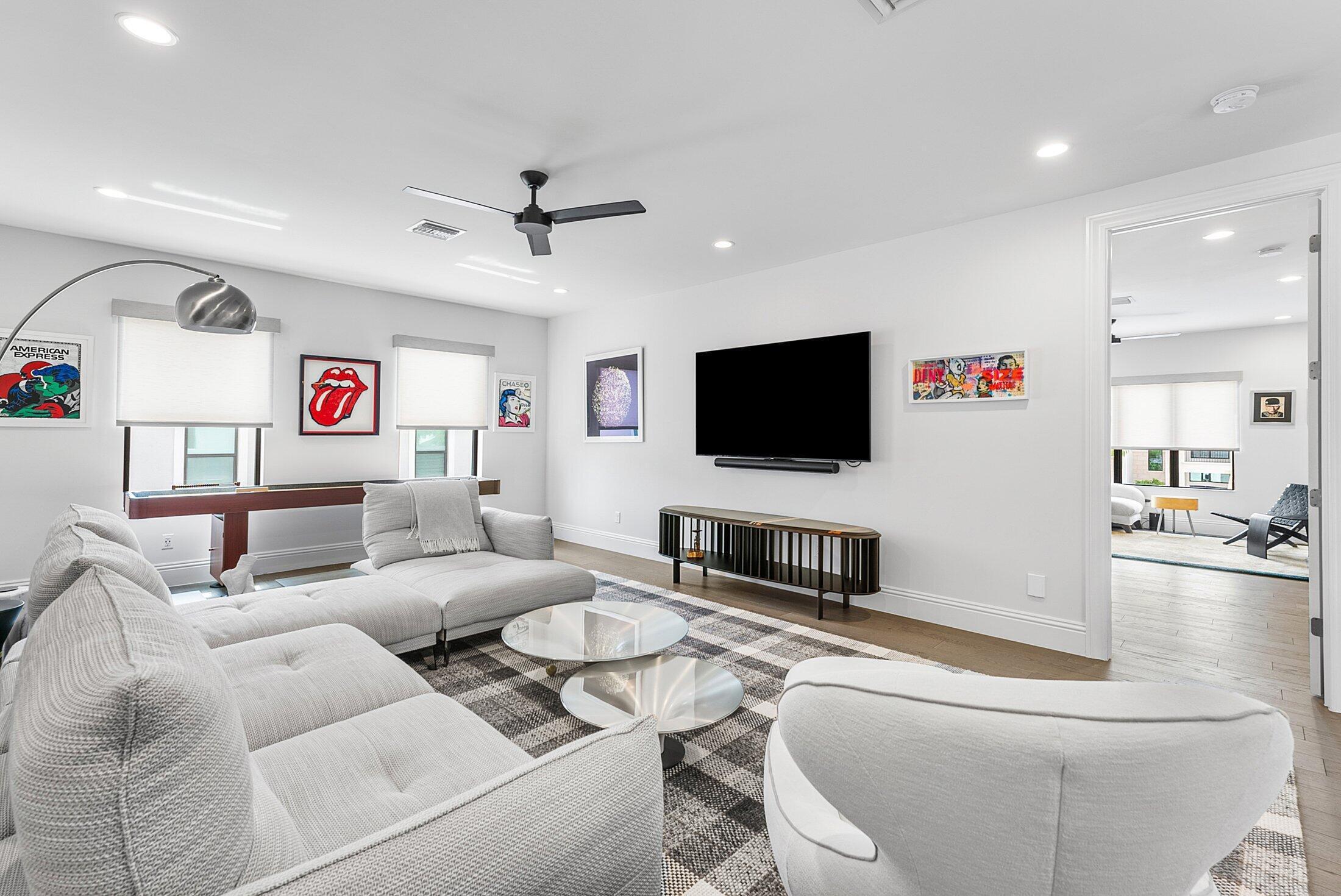 2707 Northwest 75th Street Boca Raton, FL 33496 - Photo 26 of 74 a living room with furniture and a flat screen tv