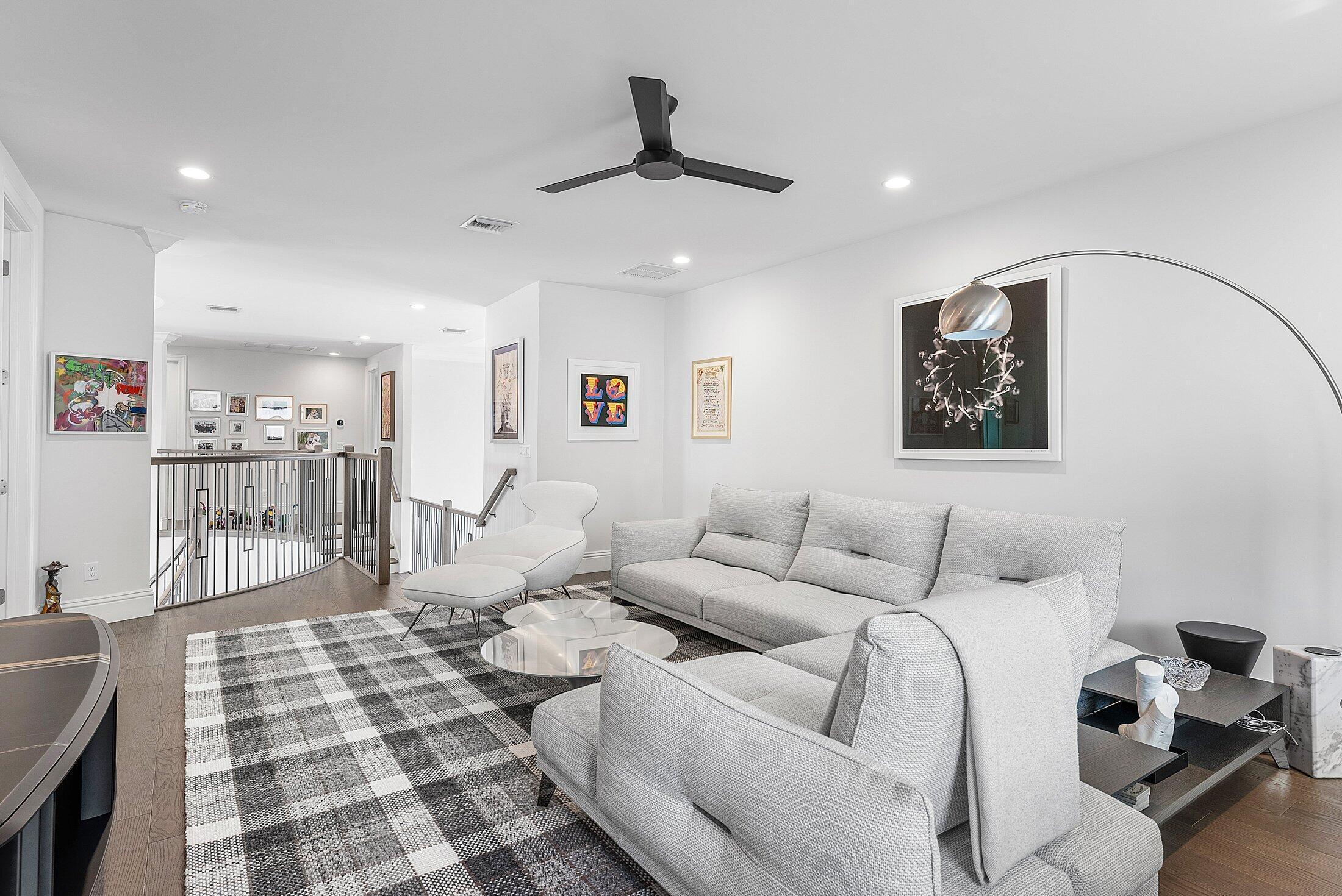 2707 Northwest 75th Street Boca Raton, FL 33496 - Photo 27 of 74 a living room with furniture and a chandelier