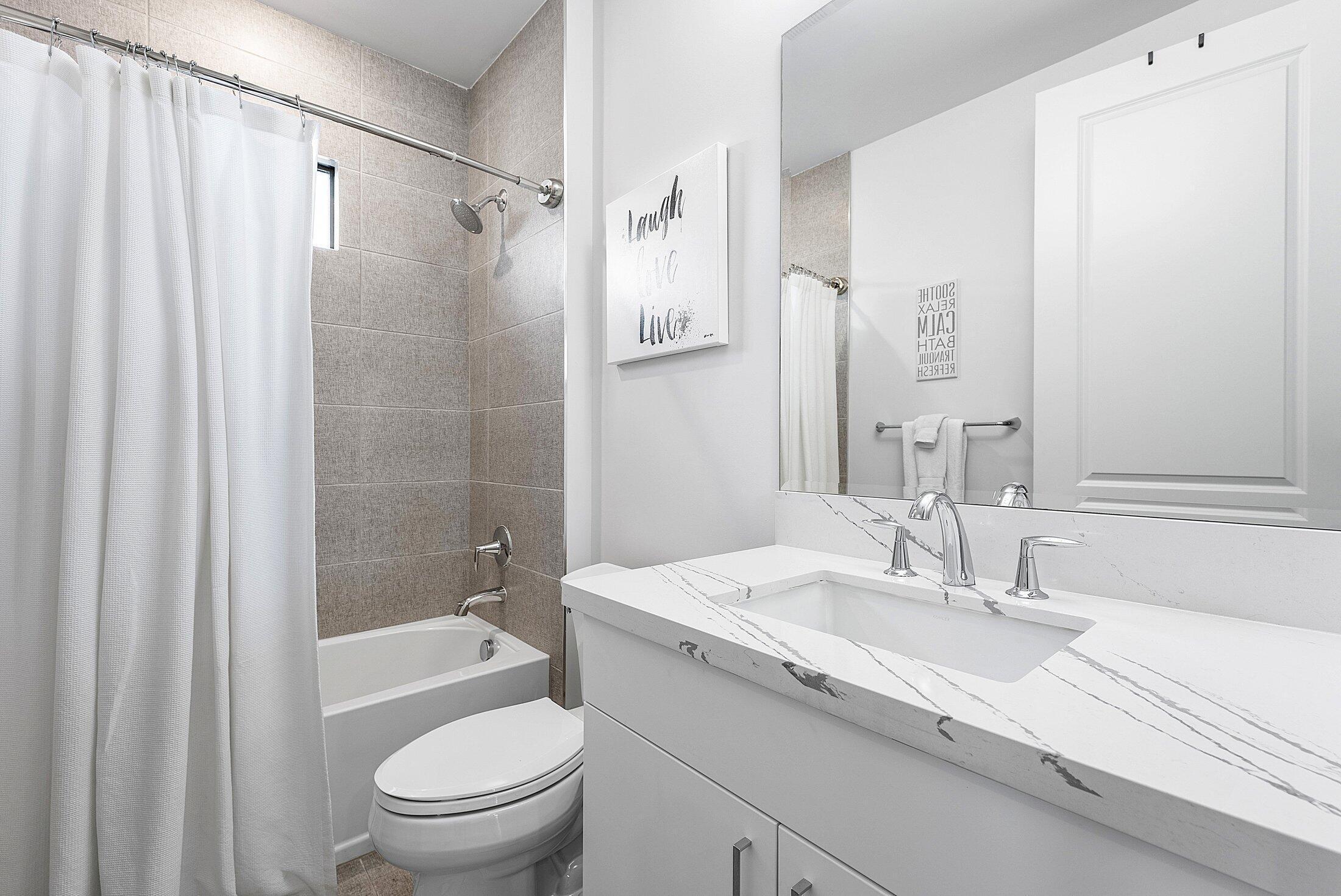 2707 Northwest 75th Street Boca Raton, FL 33496 - Photo 29 of 74 a bathroom with a granite countertop sink toilet and shower