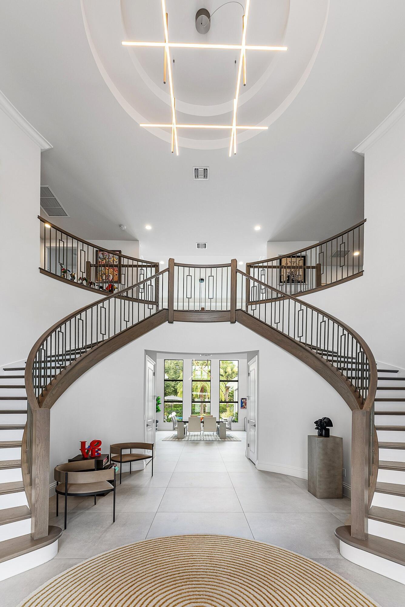 2707 Northwest 75th Street Boca Raton, FL 33496 - Photo 3 of 74 a view of entryway and hall with wooden floor