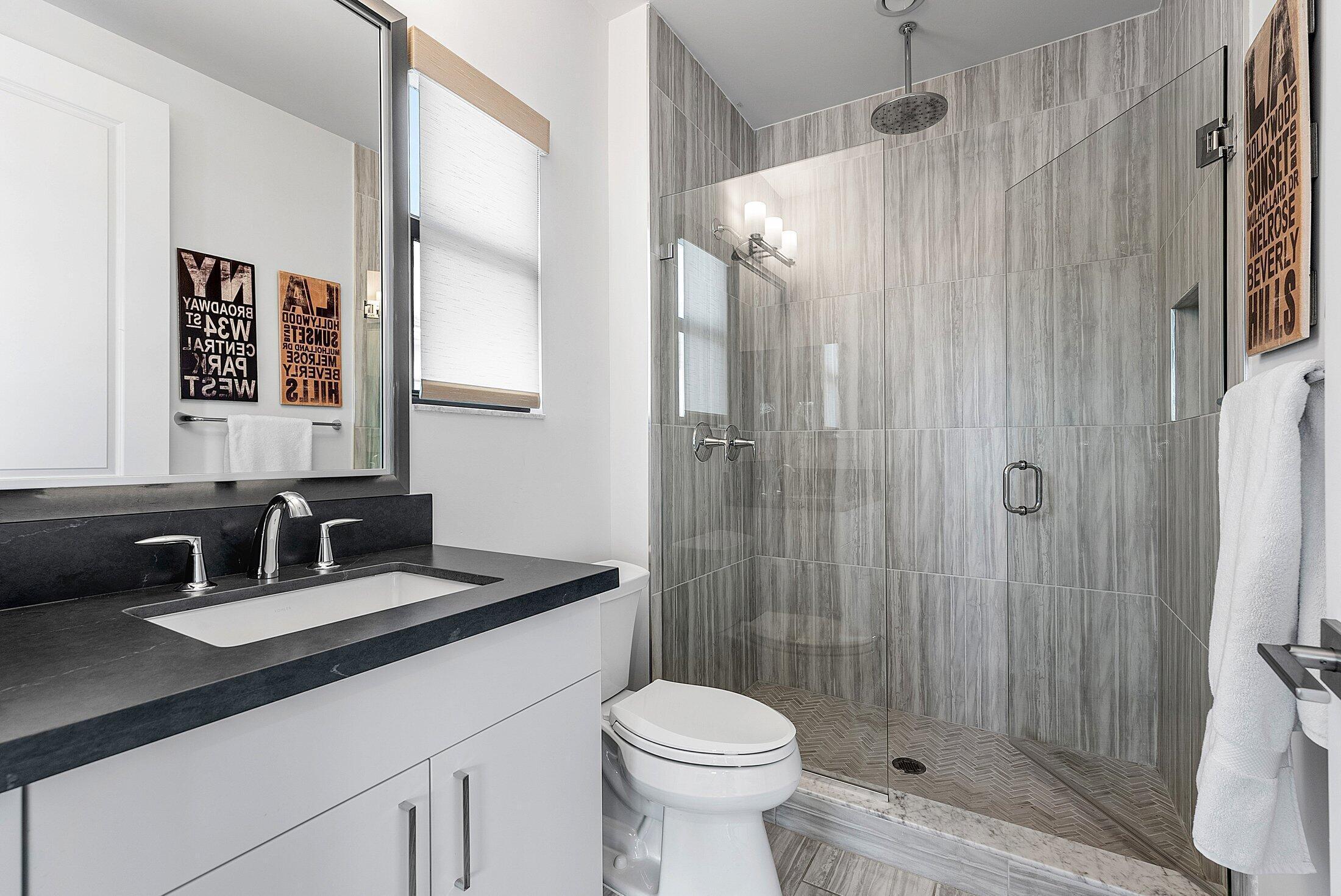 2707 Northwest 75th Street Boca Raton, FL 33496 - Photo 31 of 74 a bathroom with a sink toilet and shower