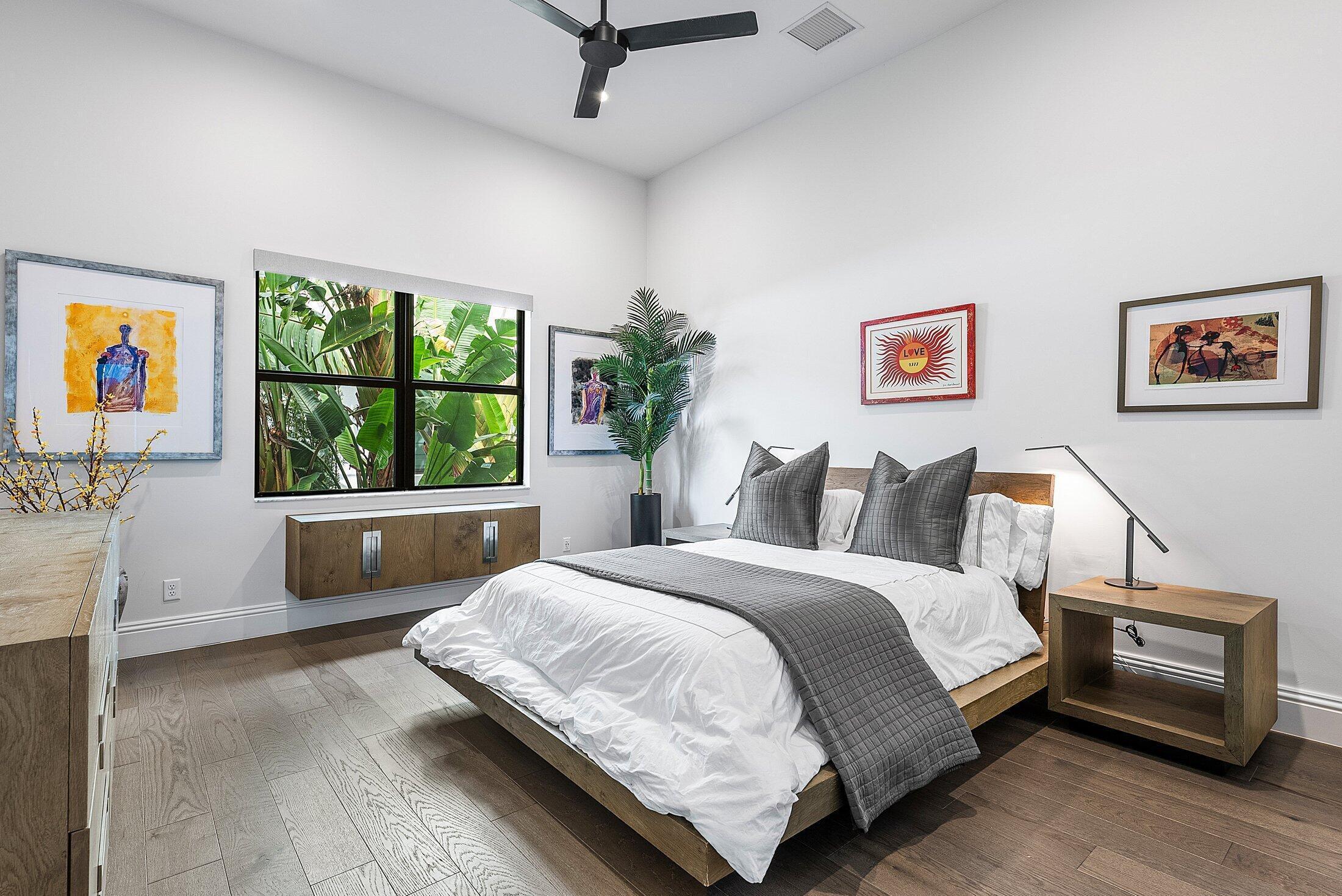 2707 Northwest 75th Street Boca Raton, FL 33496 - Photo 37 of 74 a bedroom with a bed and a window
