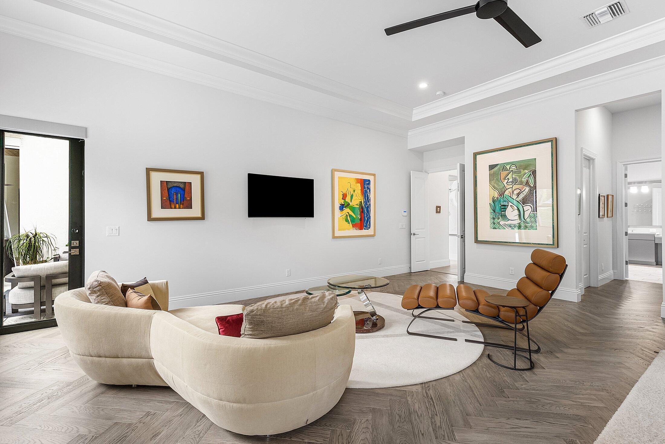 2707 Northwest 75th Street Boca Raton, FL 33496 - Photo 41 of 74 a living room with furniture and a flat screen tv