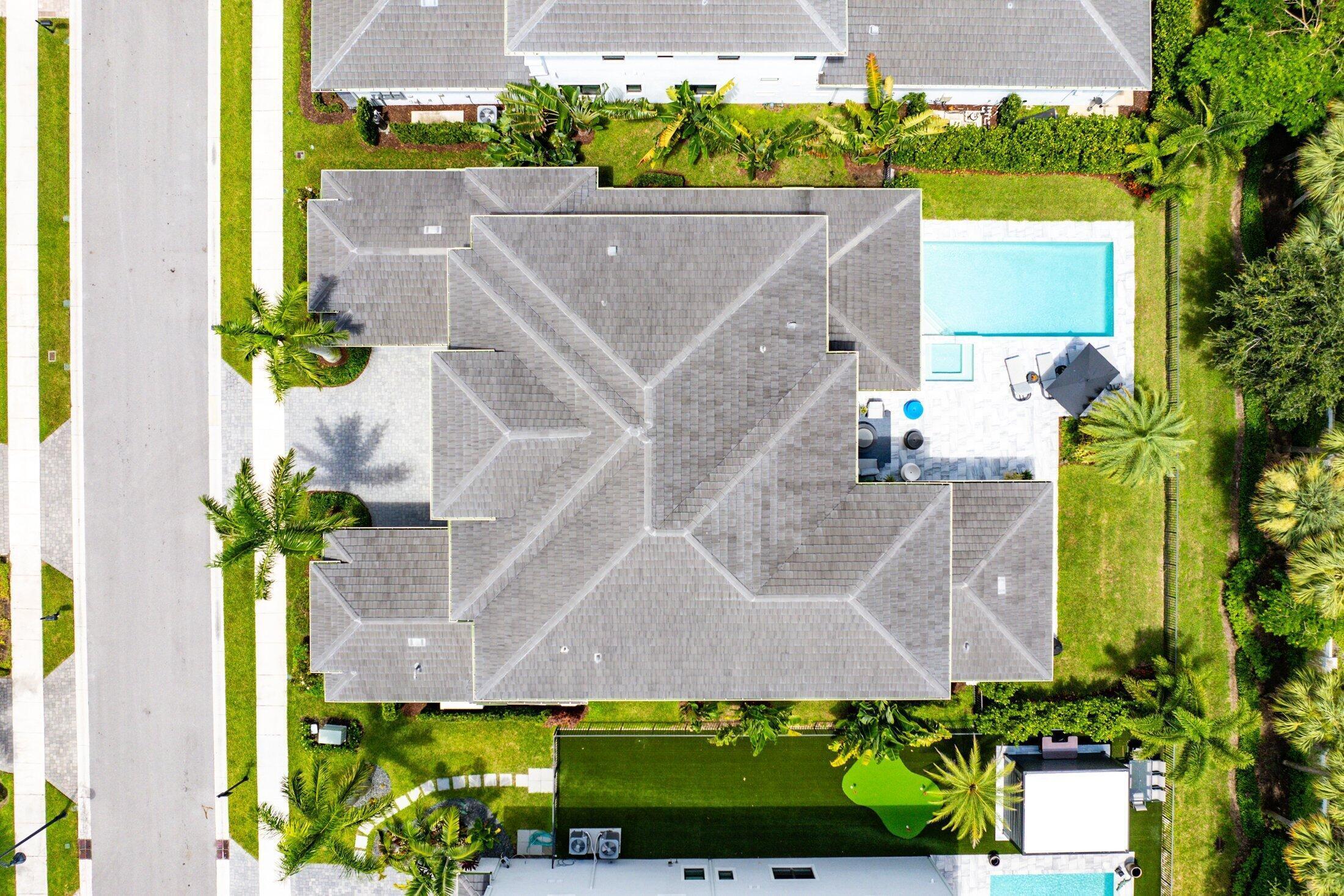 2707 Northwest 75th Street Boca Raton, FL 33496 - Photo 57 of 74 an aerial view of a house with a yard and a fountain