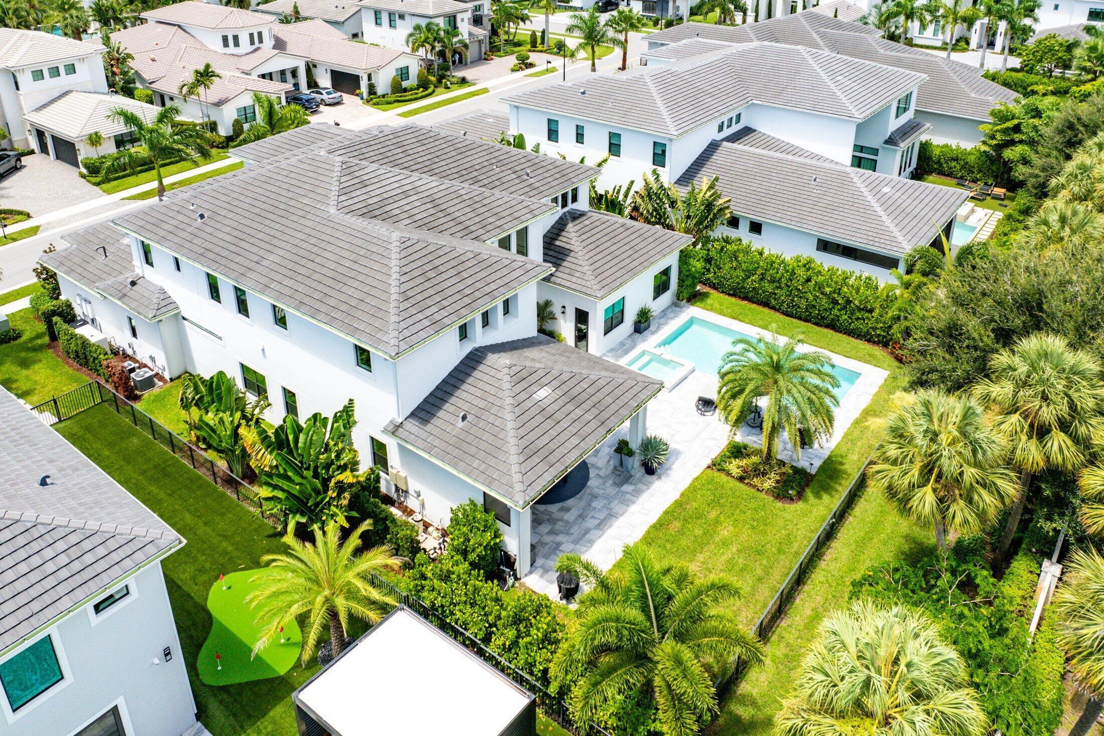 2707 Northwest 75th Street Boca Raton, FL 33496 - Photo 58 of 74 an aerial view of a house with a yard and garden