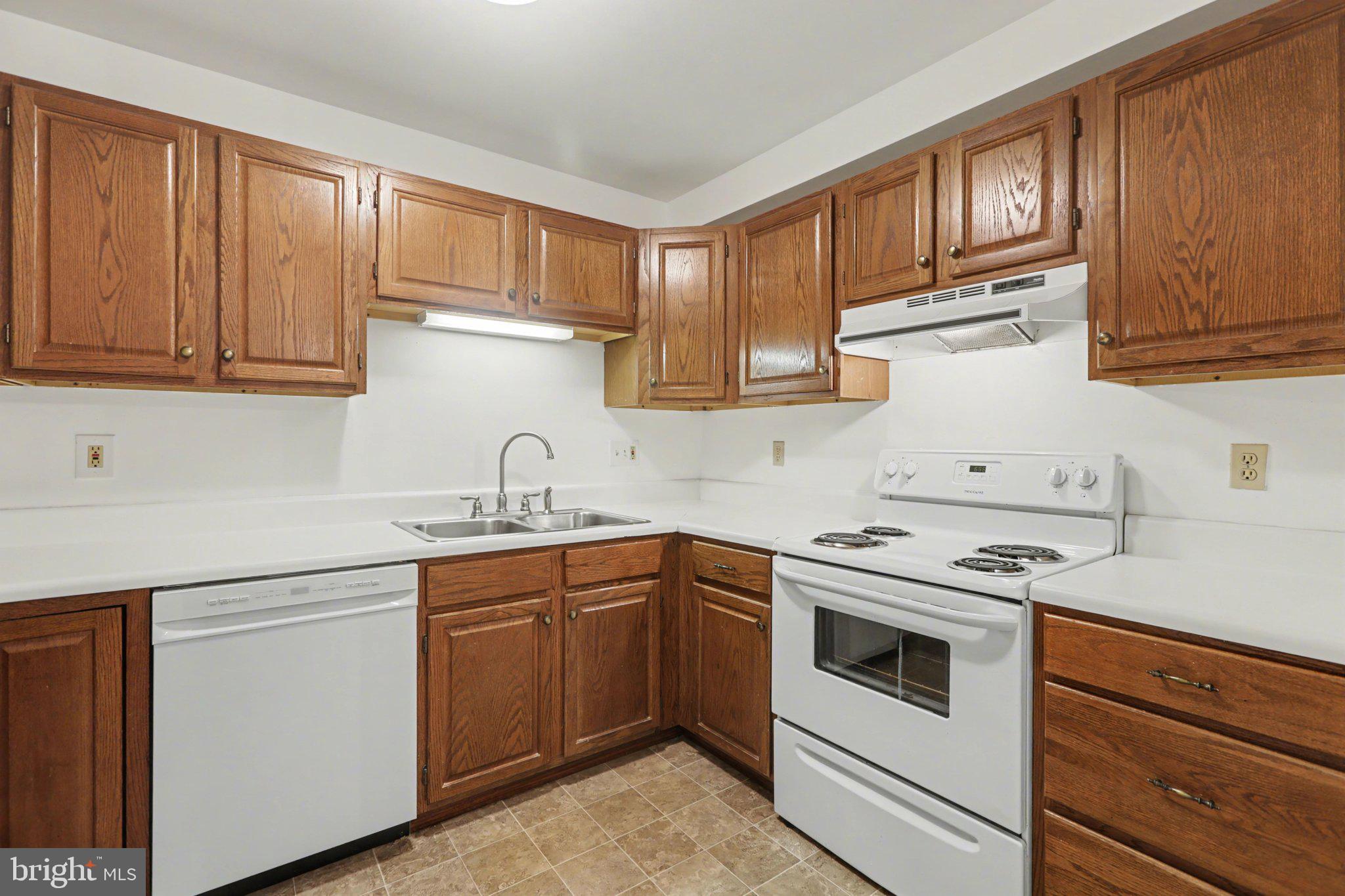 298 Colonial Road, Unit 7 Harrisburg, PA 17109 - Photo 3 of 11 a kitchen with stainless steel appliances granite countertop a sink and cabinets