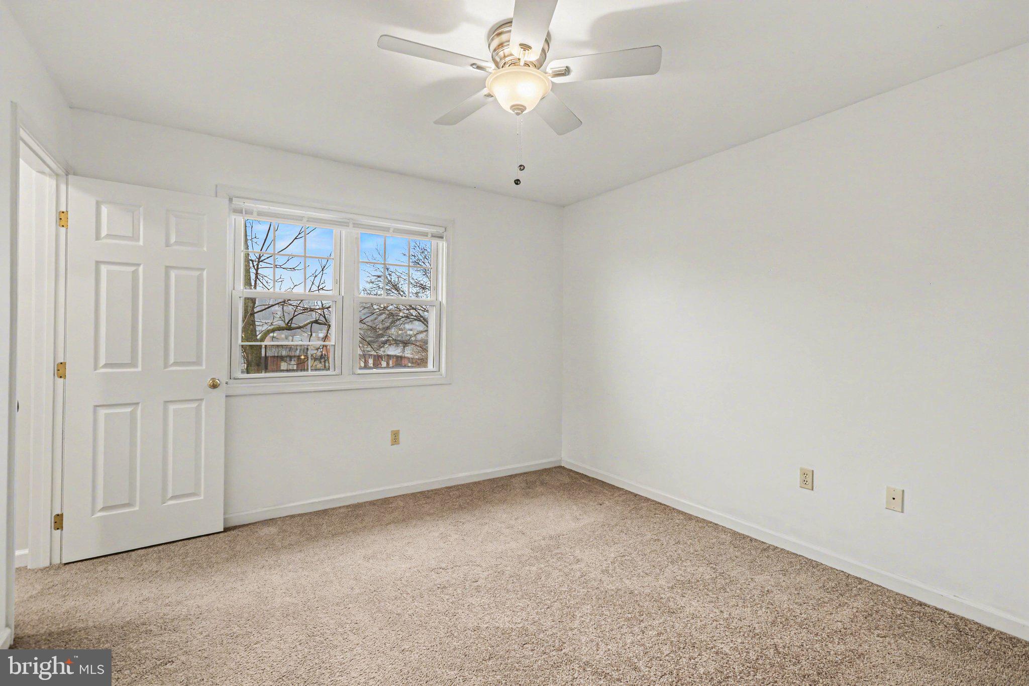 298 Colonial Road, Unit 7 Harrisburg, PA 17109 - Photo 6 of 11 a view of an empty room with a window