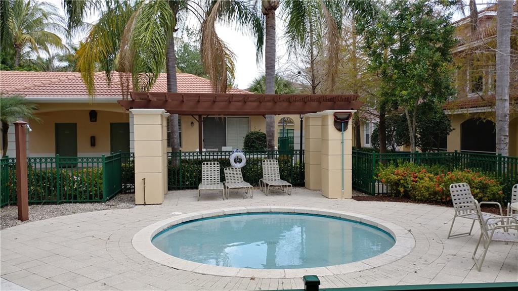 6640 West Sample Road, Unit 6640 Coral Springs, FL 33067 - Photo 19 of 25 a view of outdoor space yard swimming pool and patio
