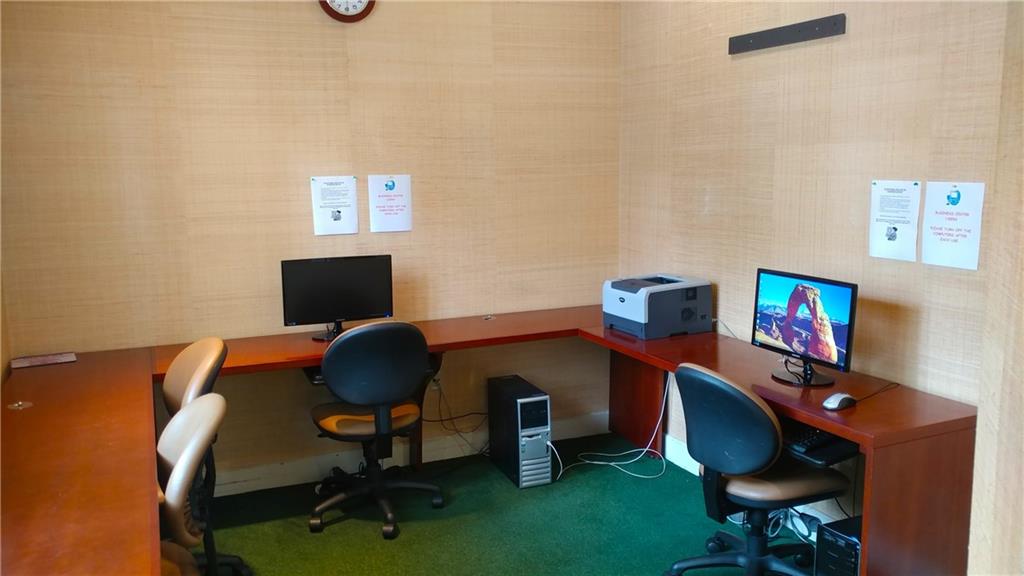 6640 West Sample Road, Unit 6640 Coral Springs, FL 33067 - Photo 21 of 25 a workspace with furniture and screen